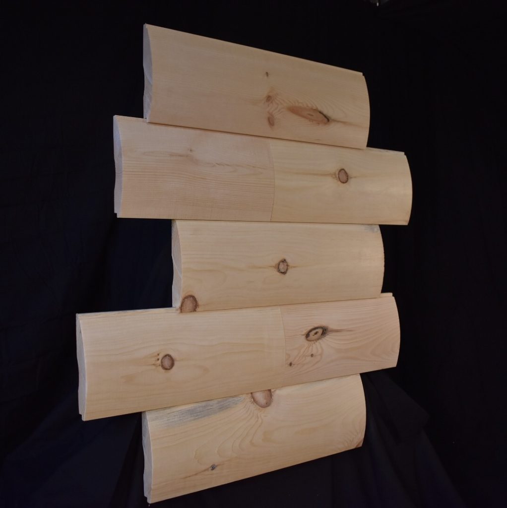 Five rounded log siding boards with knots, displayed against a black backdrop