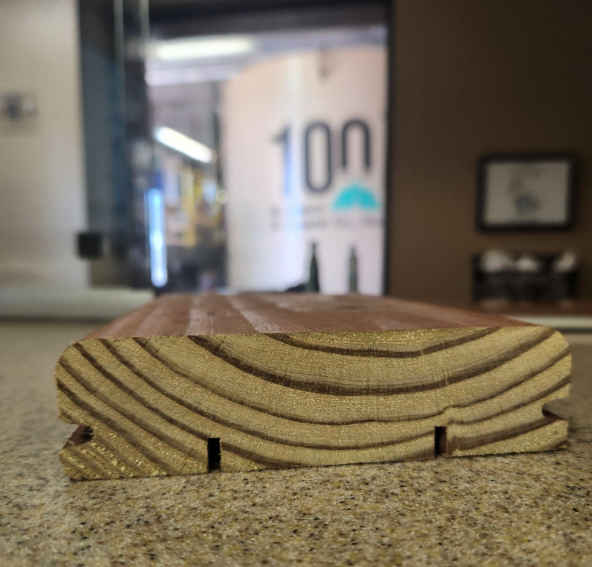 KDAT interlocking decking board showcasing smooth grain and precise fit for enhanced stability in deck framing.